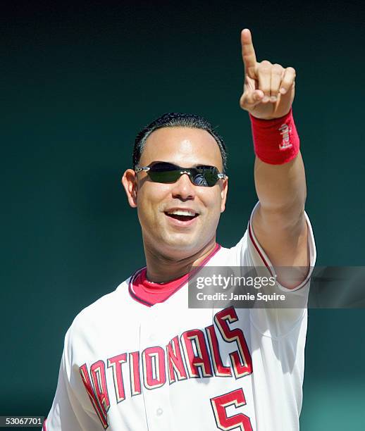 Carlos Baerga of the Washington Nationals celebrates during the game with the Seattle Mariners on May 19, 2005 at RFK Stadium in Washington, DC. The...