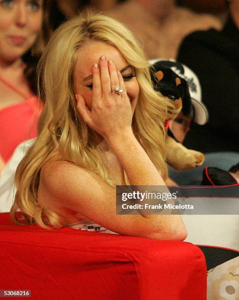 Actress Lindsay Lohan reacts to the insult dog performed by Eminem during the 2005 MTV Movie Awards at the Shrine Auditorium June 4, 2005 in Los...