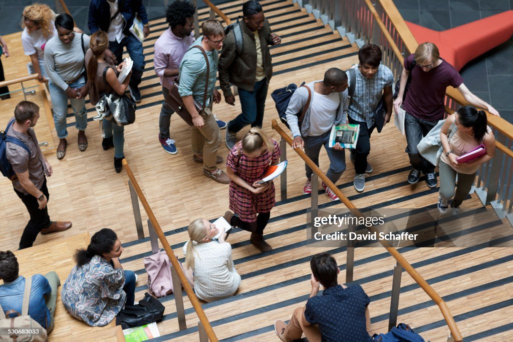 Elevated view of university students walking up and down stairs