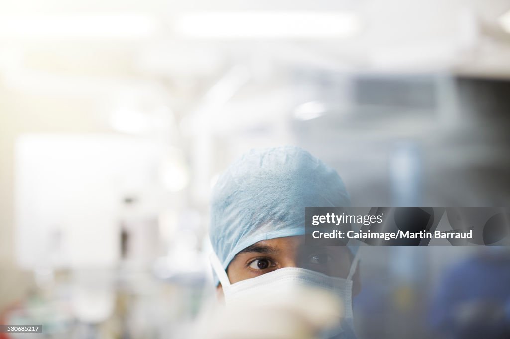 Portrait of surgeon wearing surgical cap and mask
