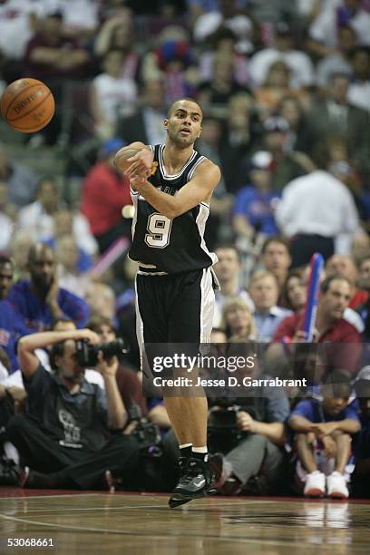Tony Parker of the San Antonio Spurs passes against the Detroit Pistons in Game three of the 2005 NBA Finals June 14, 2005 at the Palace of Auburn...