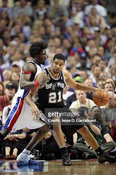 Tim Duncan of the San Antonio Spurs drives against Ben Wallace of the Detroit Pistons in Game three of the 2005 NBA Finals June 14, 2005 at the...