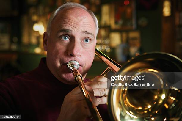man playing trombone - trombone stock pictures, royalty-free photos & images
