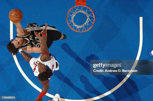 Manu Ginobili of the San Antonio Spurs drives to the basket against Ben Wallace of the Detroit Pistons in Game three of the 2005 NBA Finals on June...