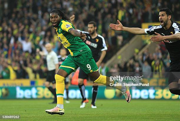 Dieumerci Mbokani of Norwich City celebrates scoring his team's second goal during the Barclays Premier League match between Norwich City and Watford...