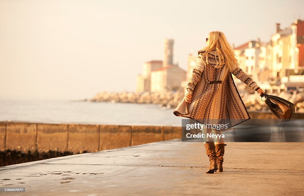 Attractive Mature Woman In Woolen Clothings Walking