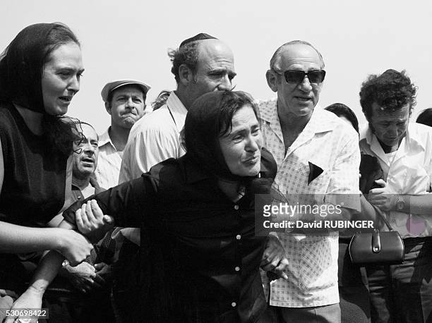 The mother of an Israeli athlete slain at the 1972 Summer Olympic Games grieves for her son at his funeral. It was the first year the modern state of...