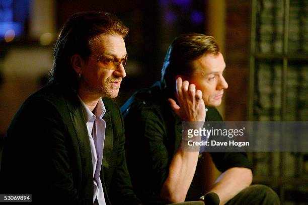 Former Live Aid artists, U2 members Bono and Larry Mullen Jr., pose for a portrait to commemorate the 20th anniversary of Live Aid, on June 14, 2005...