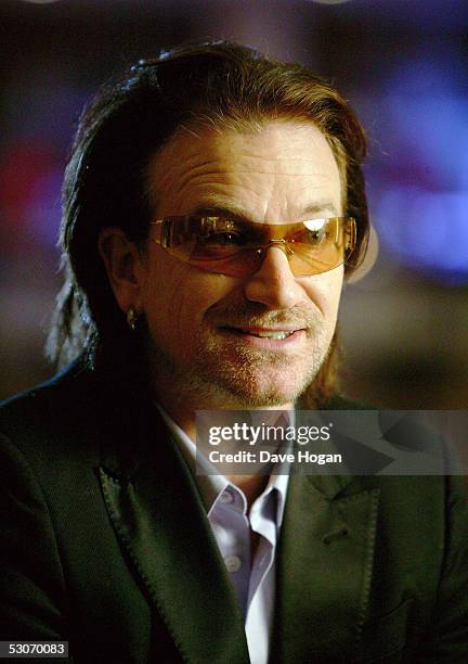 Former Live Aid artist Bono poses for a portrait to commemorate the 20th anniversary of Live Aid, on June 14, 2005 in London, England. The portraits...