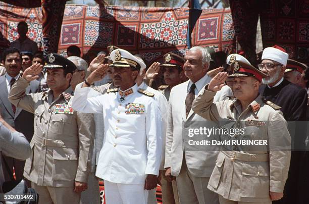 President Anwar Sadat, Muhammad Hosni Mubarak, and Ali, attend the El-Arish handing over ceremony from Israel to Egypt. | Location: El-Arish, Egypt.