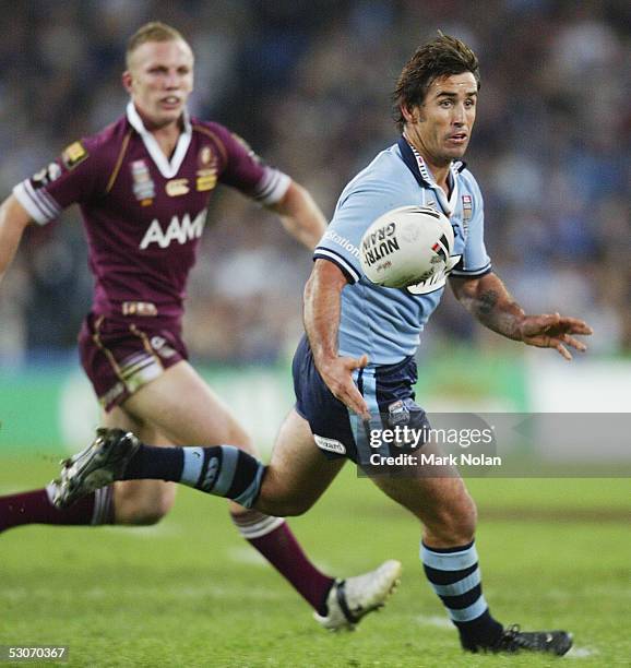 Andrew Johns of the Blues passes during the NRL State of Origin Game two, between the New South Wales Blues and the Queensland Maroons held at...