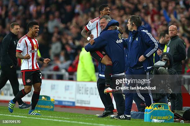 Patrick van Aanholt of Sunderland celebrates scoring his team's opening goal with manager Sam Allardyce during the Barclays Premier League match...