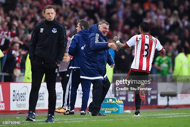 Patrick van Aanholt of Sunderland celebrates scoring his team's opening goal with manager Sam Allardyce during the Barclays Premier League match...