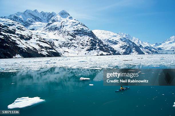 kayaker kayaking near pack ice - alaska stockfoto's en -beelden