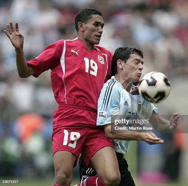 Anis Ayari of Tunisia challenges Luciano Galletti of Argentina during the FIFA Confederations Cup Match between Argentina and Tunisia on June 15,...