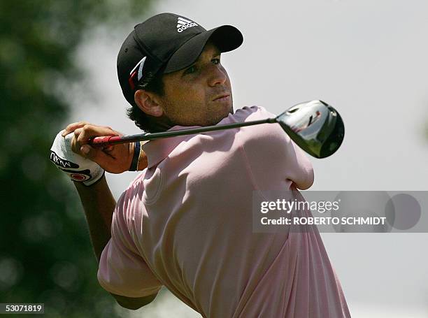 Sergio Garcia of Spain follows through on his tee shot on the 14th green during the third day of practice of the 105th US Open Championship at the...