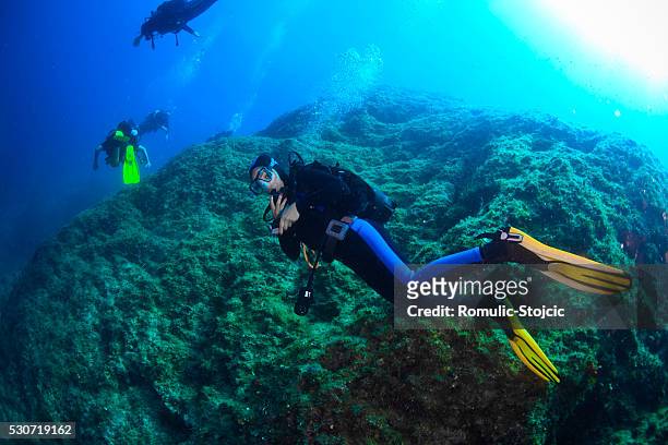 diving, group of divers, adriatic sea, croatia, europe - scuba regulator stock pictures, royalty-free photos & images