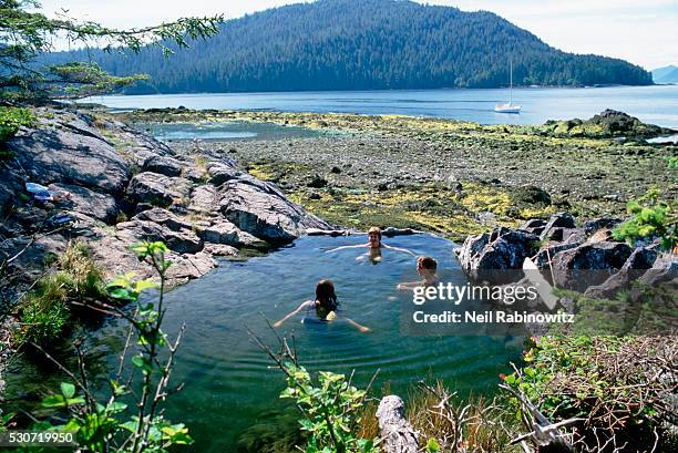 relaxing in a hot spring - queen charlotte islands stock-fotos und bilder