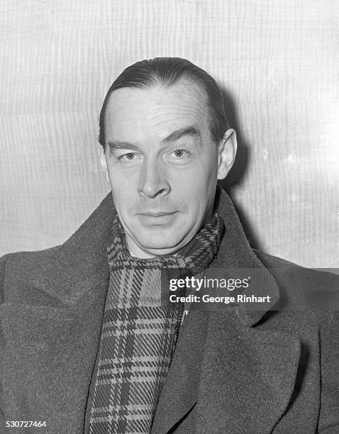 New York, NY: German novelist Erich Maria Remarque arrives in New York aboard the S.S. Queen Mary. Undated portrait of Remarque in coat and scarf.