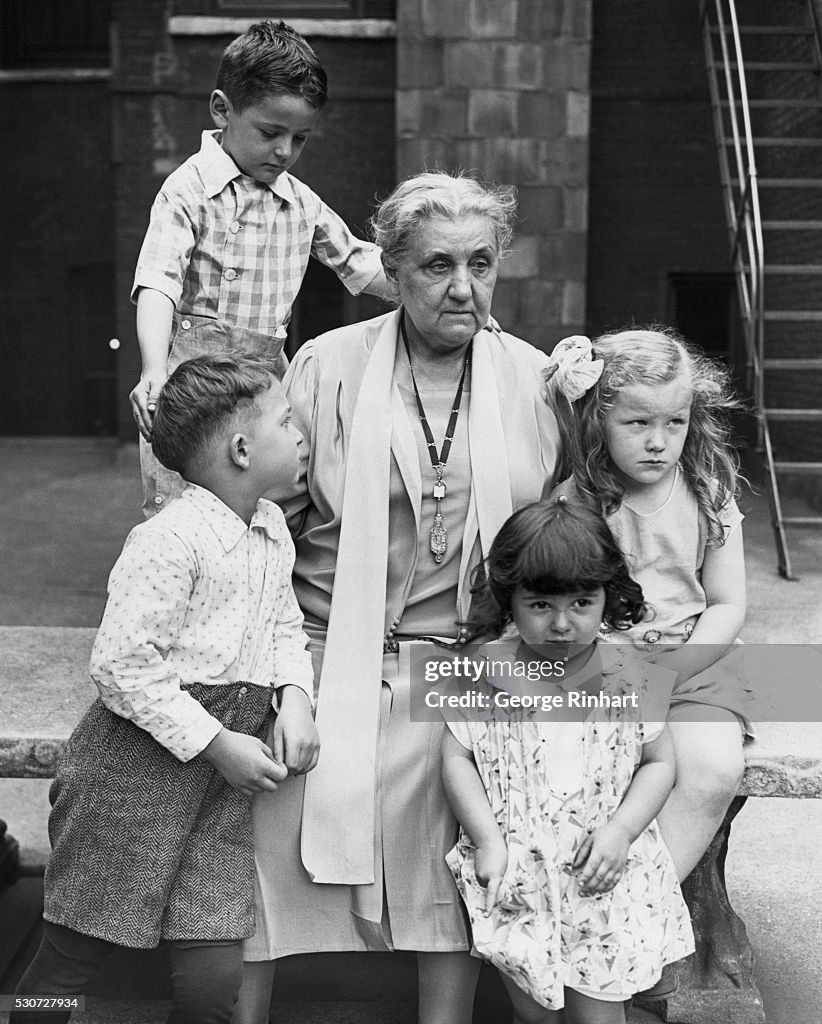 Jane Addams Seated with Children