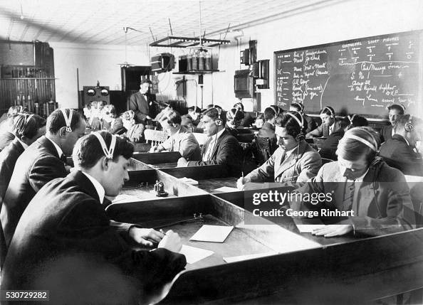 Students Seated Wearing Headphones