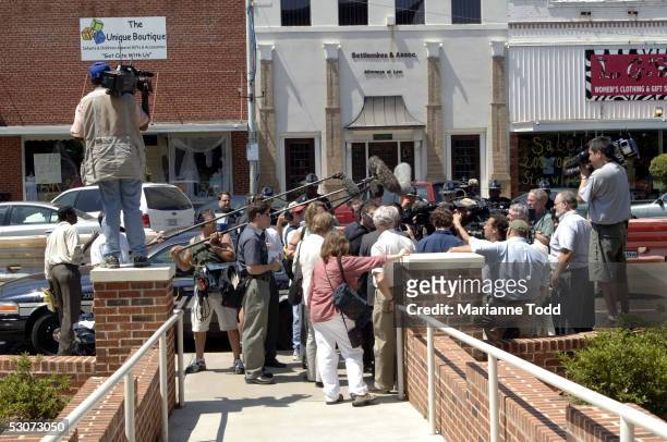 Reporters interview defense attorney James McIntyre outside the Neshoba County Courthouse after opening arguments on June 15, 2005 in Philadelphia,...