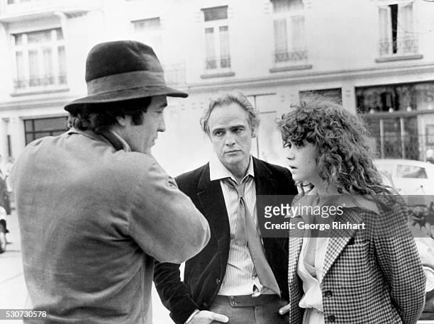 Paris, France- Marlon Brando , with director, Bernardo Bertolucci, and co-star, Maria Schneider, during filming of the picture, The Last Tango in...
