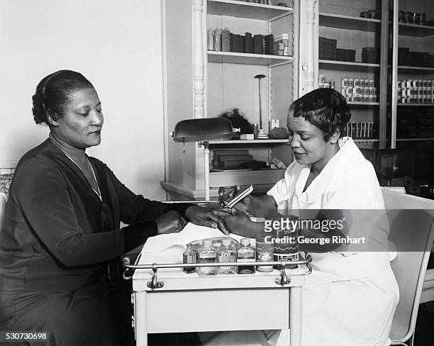 Lelia Walker, daughter of Madame C. J. Walker, gets a manicure at one of her mother's beauty shops. Madame C. J. Walker made a fortune from her chain...