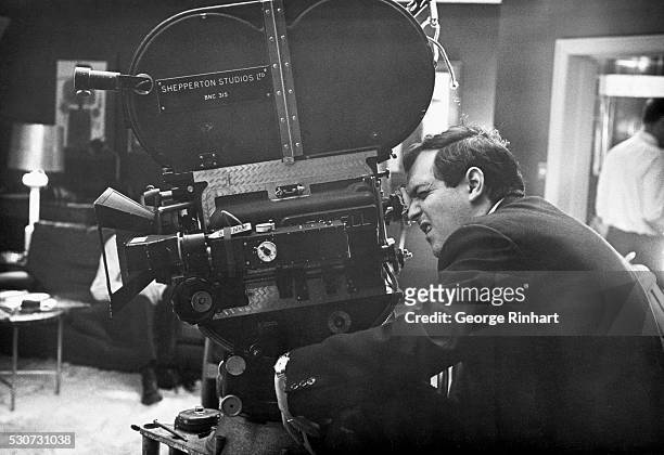 Stanley Kubrick looking through camera during filming of the 1964 movie Dr. Strangelove or: How I Learned to Stop Worrying and Love the Bomb.