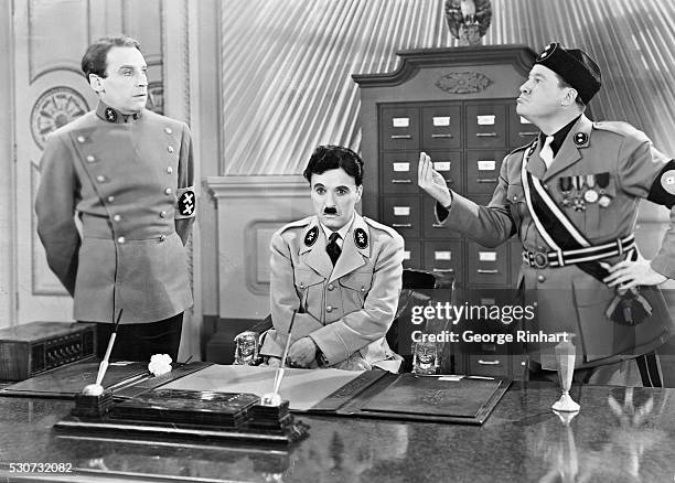 Charlie Chaplin as Hitler and Jack Oakie as Mussolini in the United Artist picture The Great Dictator .