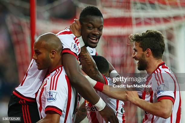 Lamine Kone of Sunderland celebrates scoring his team's third goal with team mates during the Barclays Premier League match between Sunderland and...