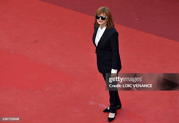 Actress Susan Sarandon poses as she arrives on May 11, 2016 for the opening ceremony of the 69th Cannes Film Festival in Cannes, southern France. /...