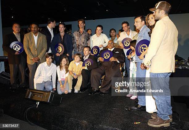 Celebrity dads and their children pose onstage at the Golden Dads Awards ceremony at the Peterson Automotive Museum on June 15, 2005 in Los Angeles,...