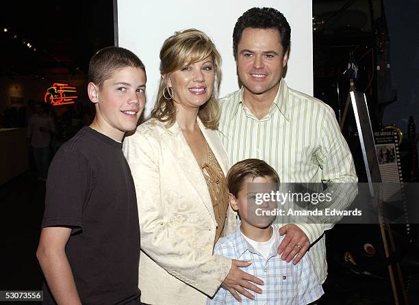 Singer Donny Osmond, his wife Debbie and their sons Chris and Joshua arrive at the Golden Dads Awards ceremony at the Peterson Automotive Museum on...