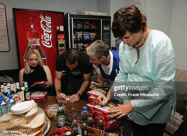 Cast members of the Comedy Central show "Reno 911" Wendi McLendon-Covey, Thomas Lennon, Carlos Alazraqui and Kerri Kenney-Silver sign copies of "Reno...