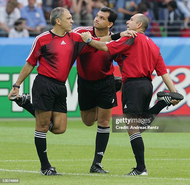 The three Referees Manuel Bernal, Carlos Amarilla and Amelio Andino of Paraguay beeing warm up before the FIFA Confederations Cup 2005 match between...