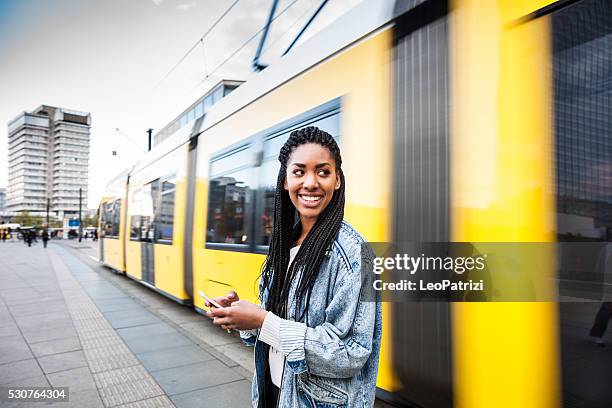 young woman walking in berlin - alexanderplatz - tram stock pictures, royalty-free photos & images