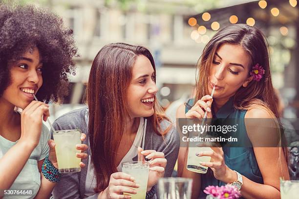 friends drinking cocktails together - group of people cafe stock pictures, royalty-free photos & images