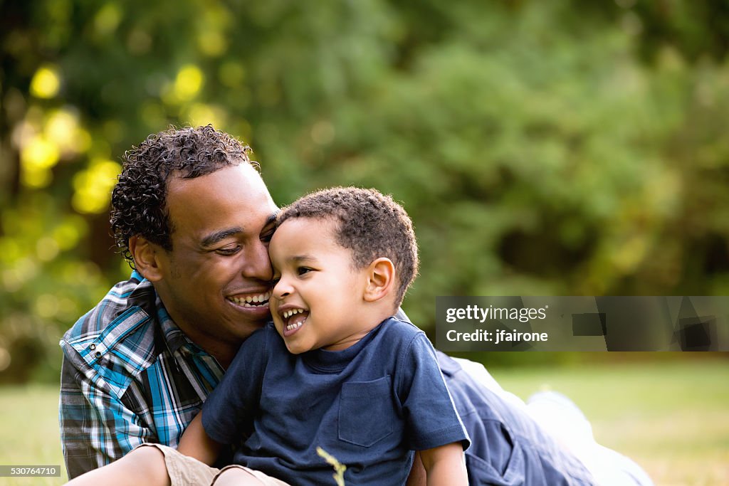 African American Father and Young Son outdoors