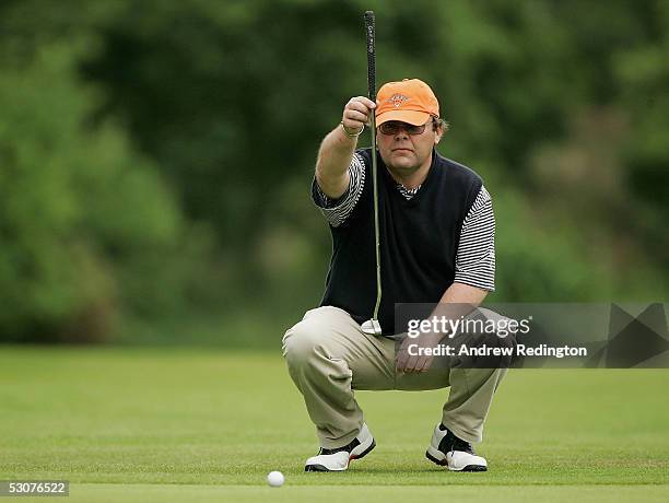 Fraser Mann of Musselburgh Golf Club lines up his putt on the 18th hole during the third round of The Glenmuir Club Professional Championship at...