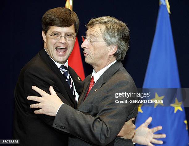 Dutch Prime Minister Jan Peter Balkenende is greeted by Luxembourg Prime Minister Jean-Claude Juncker, whose country currently holds the rotating...
