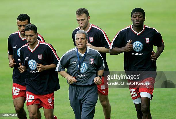 Jawhar Mnari, Anis Ayari, Karim Essedri and Radhi Jaidi run during the Tunisian National Team training session for the FIFA Confederations Cup 2005...
