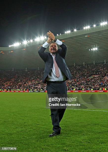Sunderland manager Sam Allardyce applauds the fans on the final whistle during the Barclays Premier League match between Sunderland and Everton at...