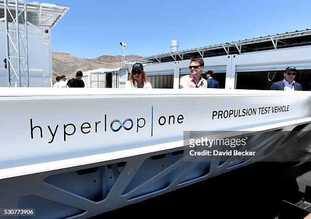 People look at a demostration test sled after the first test of the propulsion system at the Hyperloop One Test and Safety site on May 11, 2016 in...