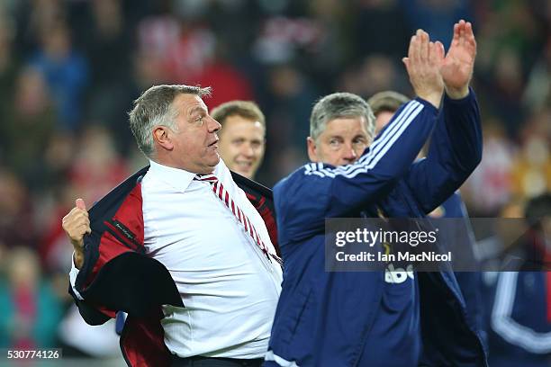 Sam Allardyce, manager of Sunderland celebrates staying in the Premier League after victory during the Barclays Premier League match between...