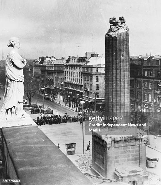 The bombing of Nelson's Pillar in O Connell Street, some of the remains of the pillar and the damge that was caused, circa March 1966. .