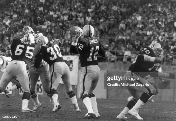 Ken Stabler of the Oakland Raiders looks to pass during the game against the San Diego Chargers at Oakland Alameda Coliseum on October 29, 1978 in...