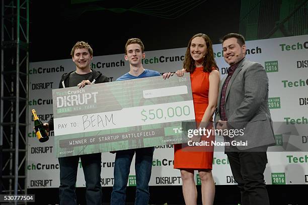 Winners of TechCrunch Distrupt Startup Battlefield, James Boehm and Matt Salsamendi of Beam pose with Editor in Chief at TechCrunch Matthew Panzarino...