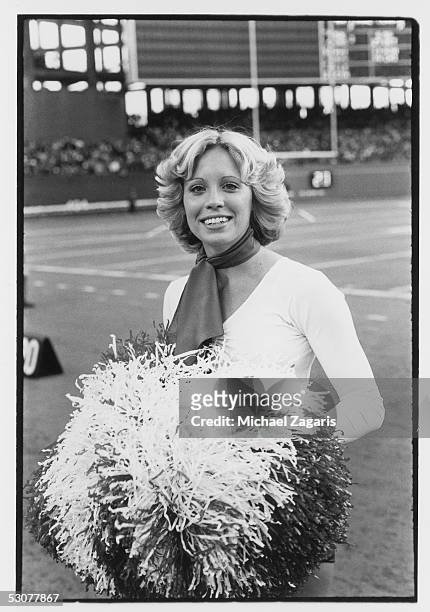 St. Louis Cardinals cheerleader cheers for her team against the San Francisco 49ers at Busch Stadium on October 31, 1976 in St. Louis, Missouri. The...