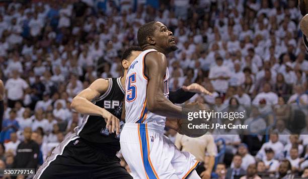 Kevin Durant of the Oklahoma City Thunder looks for a shot against the San Antonio Spurs during Game Four of the Western Conference Semifinals during...